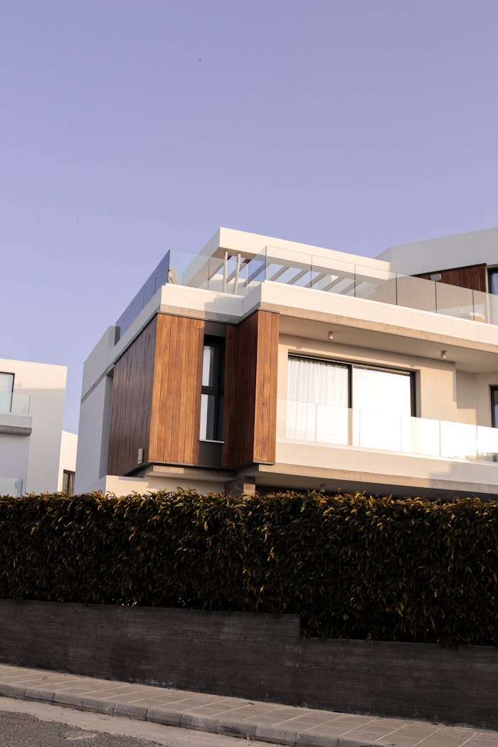 services-01 Contemporary white and wooden villa exterior shot at daytime with elegant design.